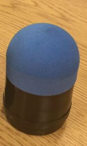 A projectile with black plastic base and blue hard foam tip