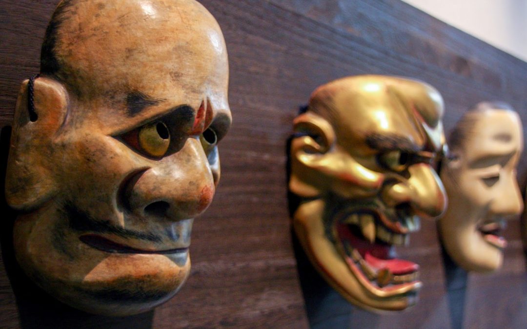 Picture of three masks used for theatre showing different emotions